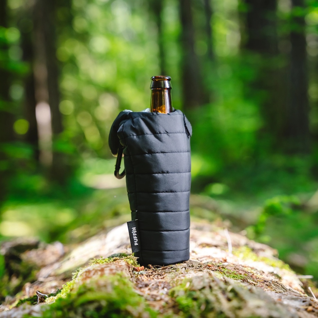 dress-up, for drinks. Puffin Drinkware lends a flair to any beverage with their creative koozies. We especially love The OG, a sleeping bag-shaped koozie that inspired the entire brand. 
